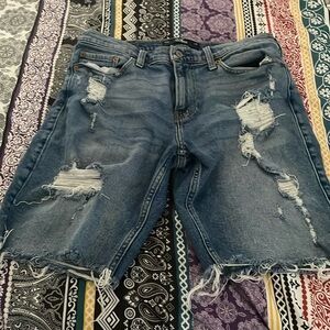 Denim  blue Hollister shorts with rips in the front size 31 men